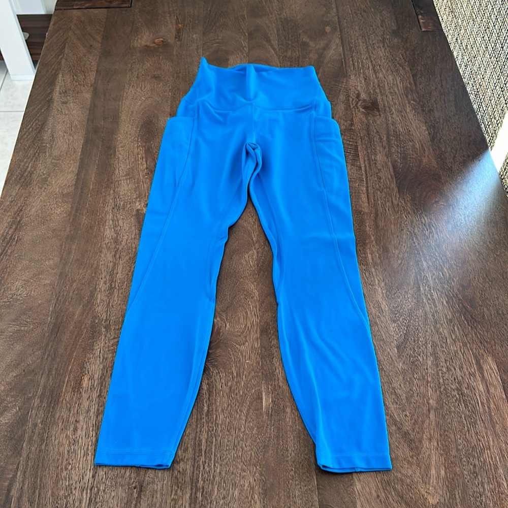 Lululemon blue, cropped size 2 yoga pants with pockets.